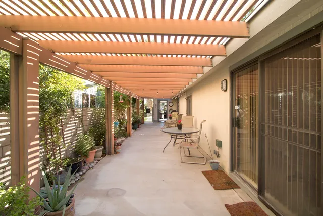 a living room with furniture ceiling fan and a rug