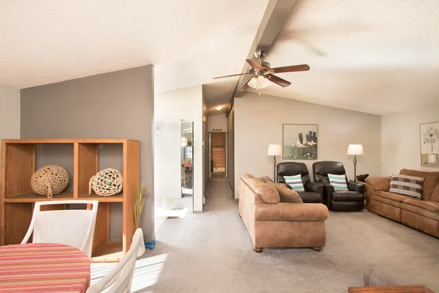 a kitchen with stainless steel appliances granite countertop a stove a sink and white cabinets