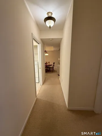 a view of a hallway to a bedroom