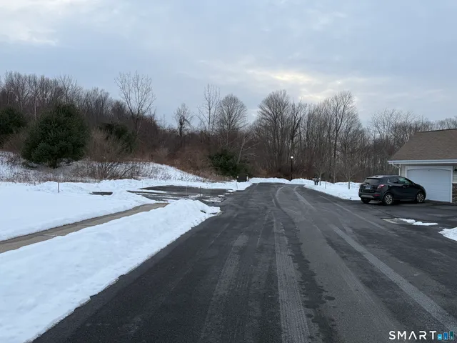 a view of a house with a street