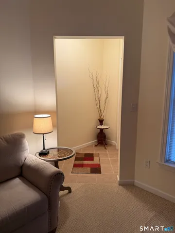 a living room with a couch and a window