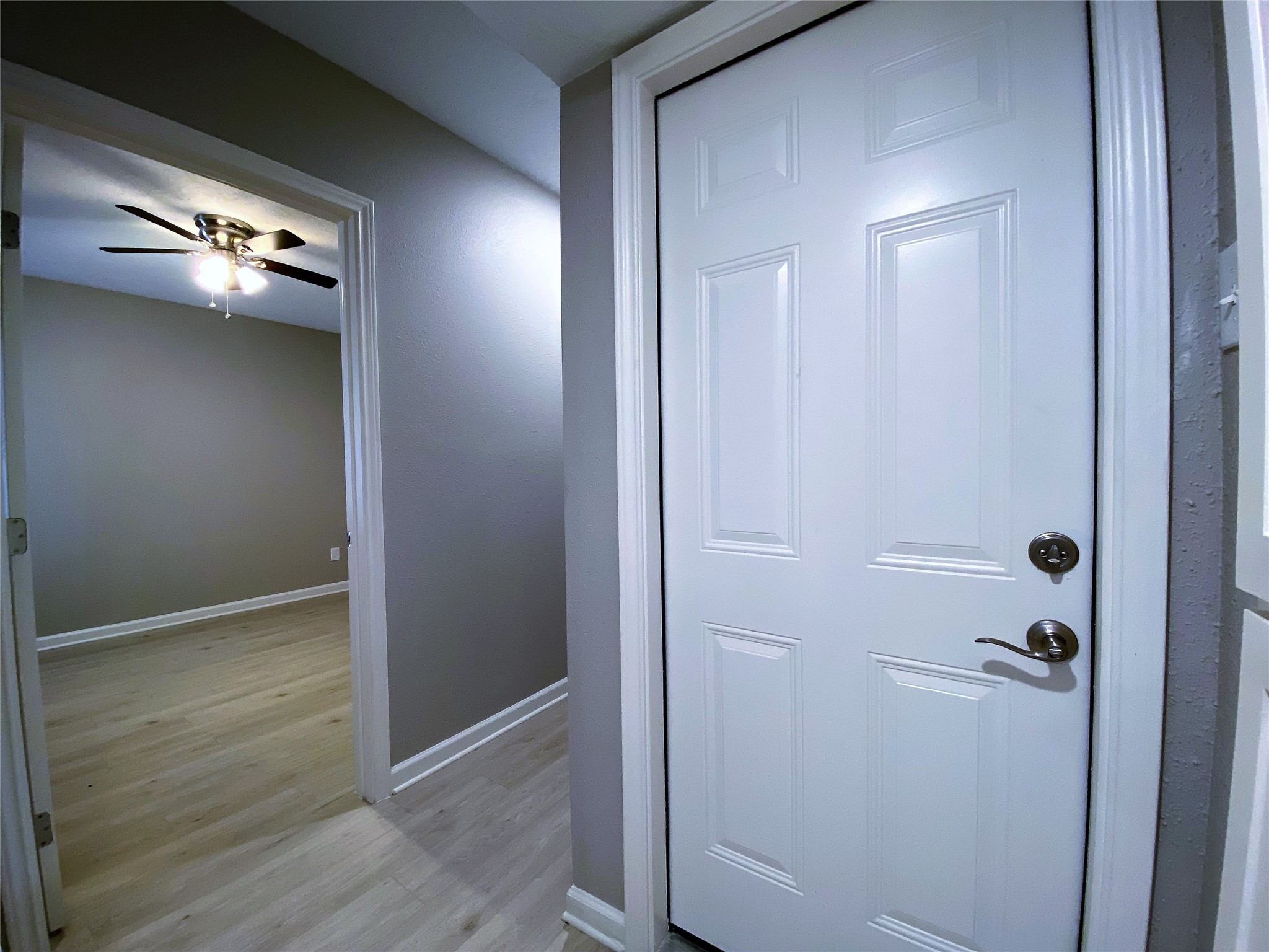 1702 Studewood Street Houston, TX 77009 - Photo 6 of 11 Beyond the door on the right is a private garage. Across the hallway is the back bedroom.