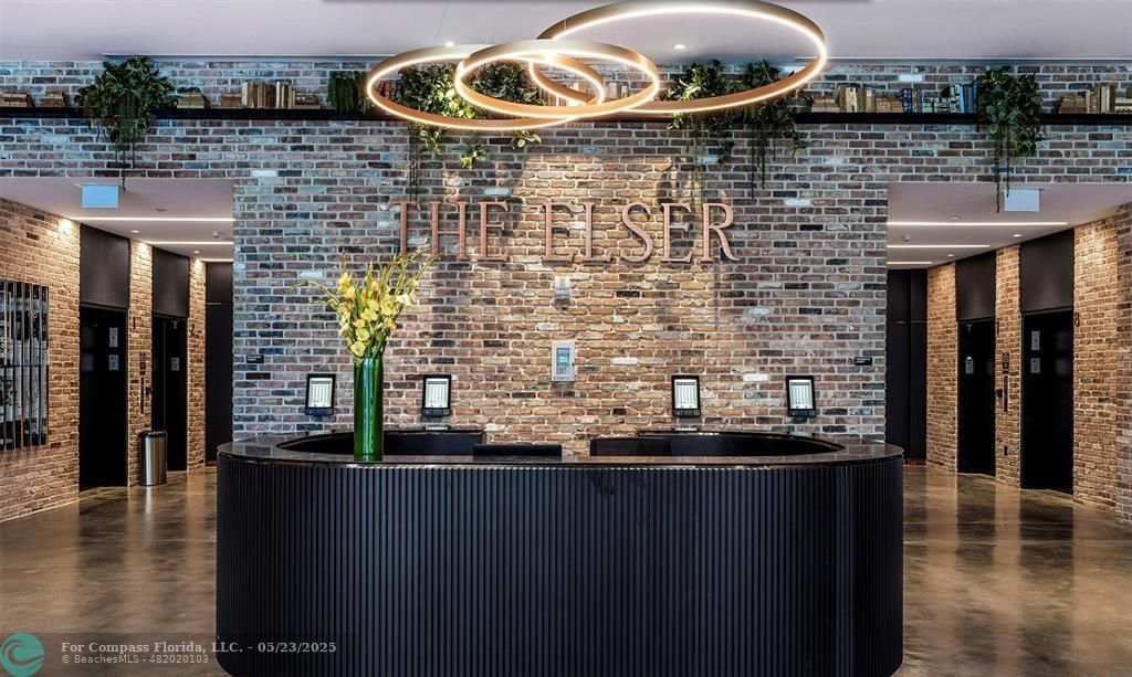 398 Northeast 5th Street, Unit 4015 Miami, FL 33132 - Photo 2 of 9 a bathroom with a sink and a mirror