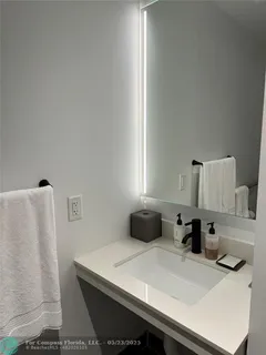 a bedroom with a bed and a lamp