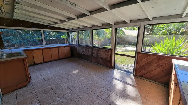 a kitchen with stainless steel appliances granite countertop a stove a refrigerator and a wooden cabinets