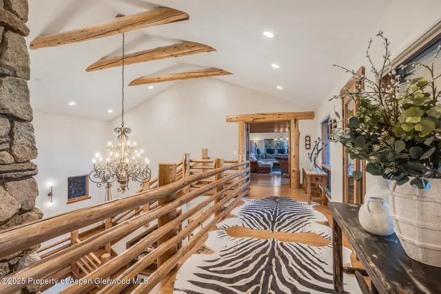 a bedroom with a bed and a television