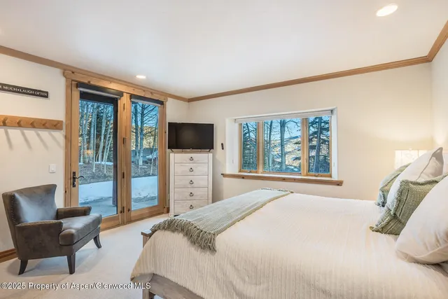 a balcony with chairs and a table