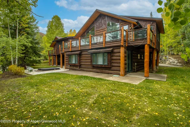a view of a house with a tree