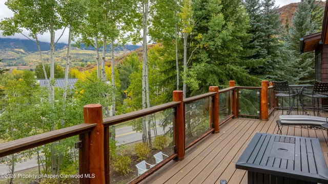 a living room with fireplace furniture and a flat screen tv