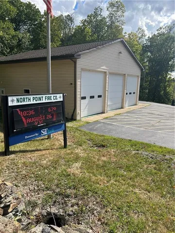 a view of a big yard with a large trees