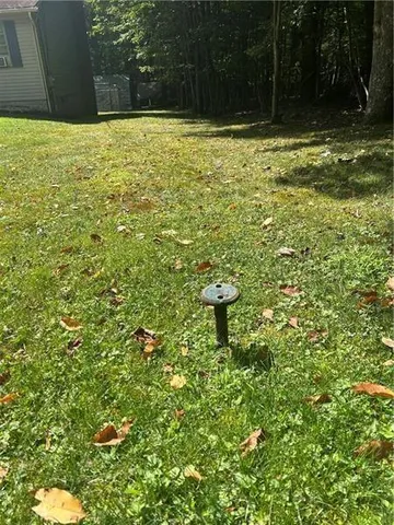 a view of a backyard of the house