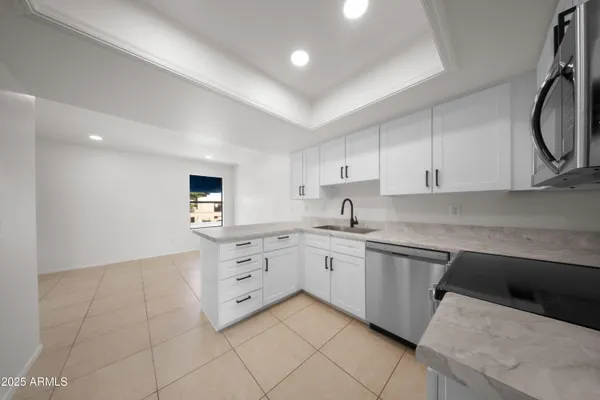 a kitchen with cabinets and sink