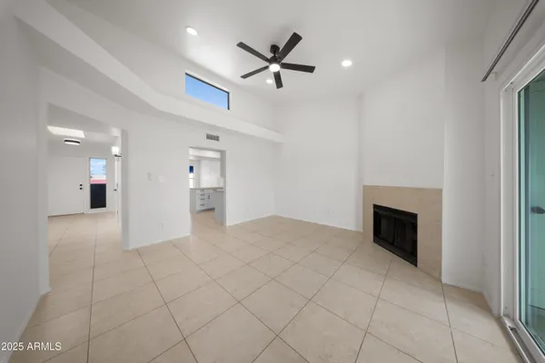 a view of an empty room with a fireplace