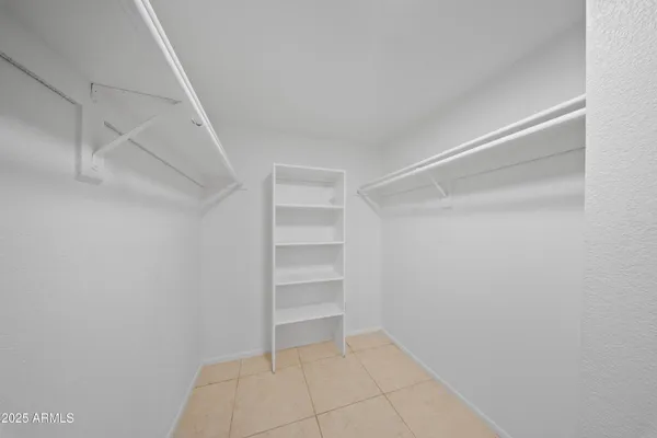 a view of an empty walk in closet