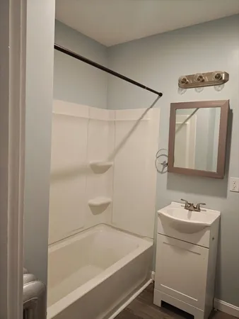 a bathroom with a sink toilet and tub
