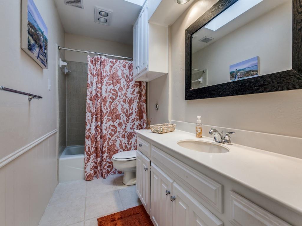 4020 Morman Lane Addison, TX 75001 - Photo 22 of 25 a bathroom with a sink toilet and shower