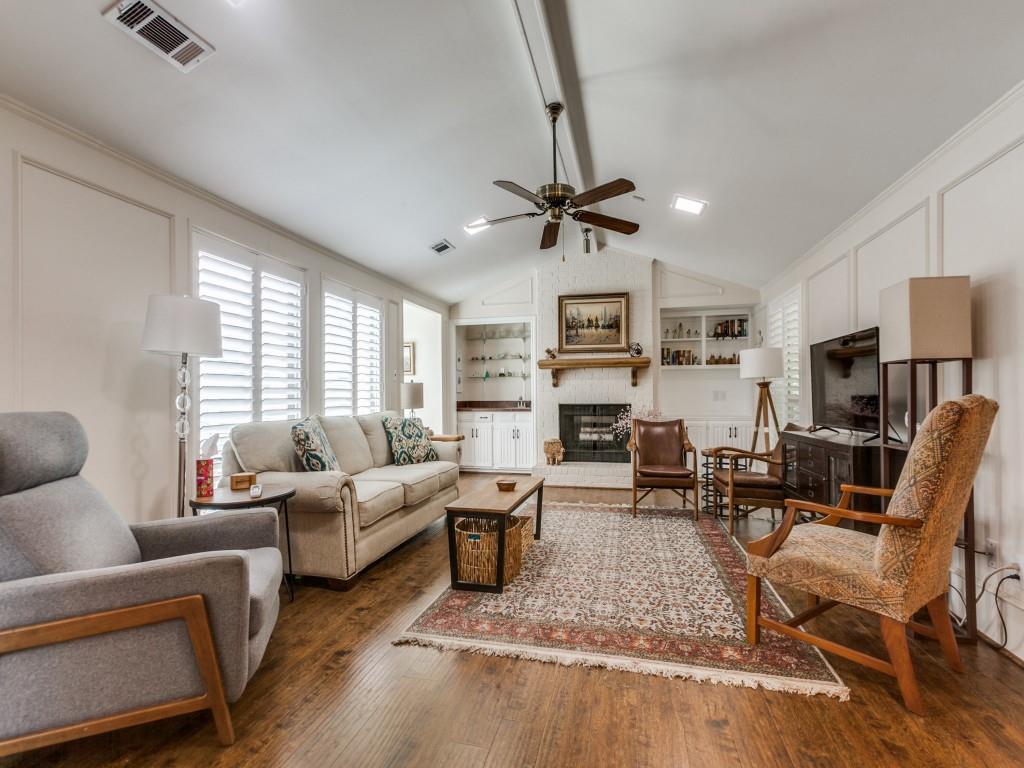 4020 Morman Lane Addison, TX 75001 - Photo 4 of 25 a living room with furniture a fireplace and a window