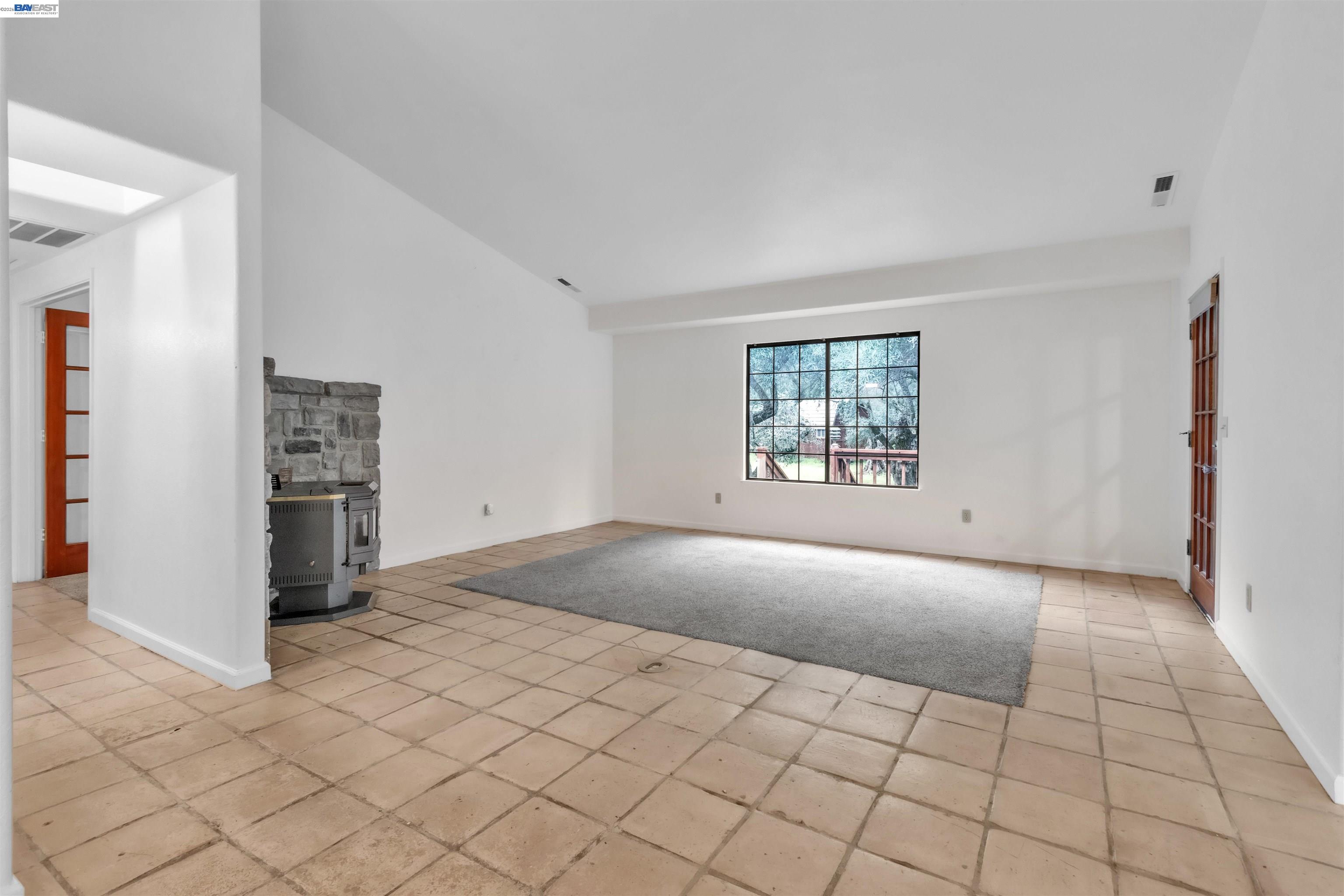 3665 Illinois Avenue Corning, CA 96021 - Photo 11 of 54 an empty room with windows