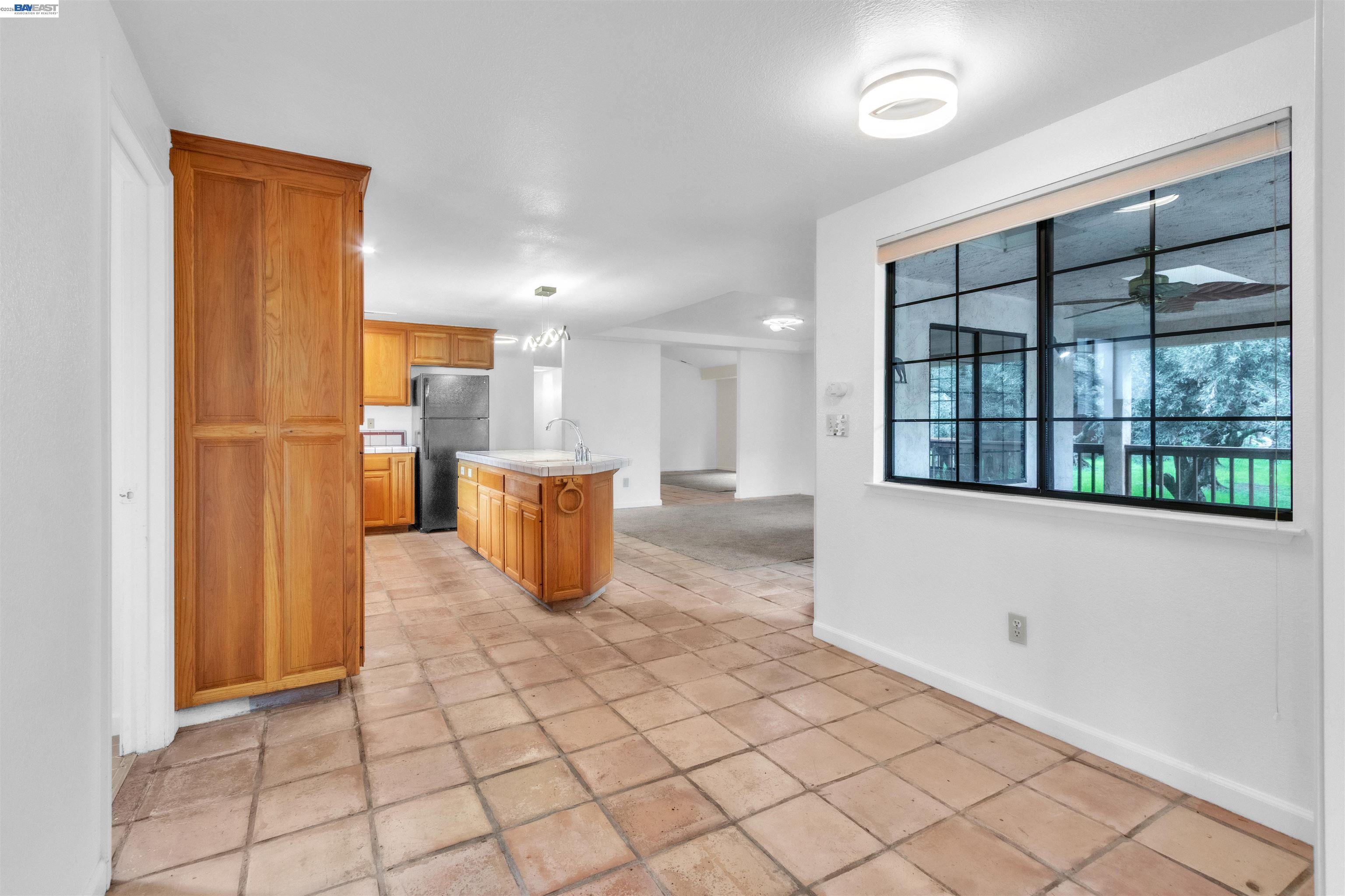 3665 Illinois Avenue Corning, CA 96021 - Photo 21 of 54 a view of kitchen with furniture and large window