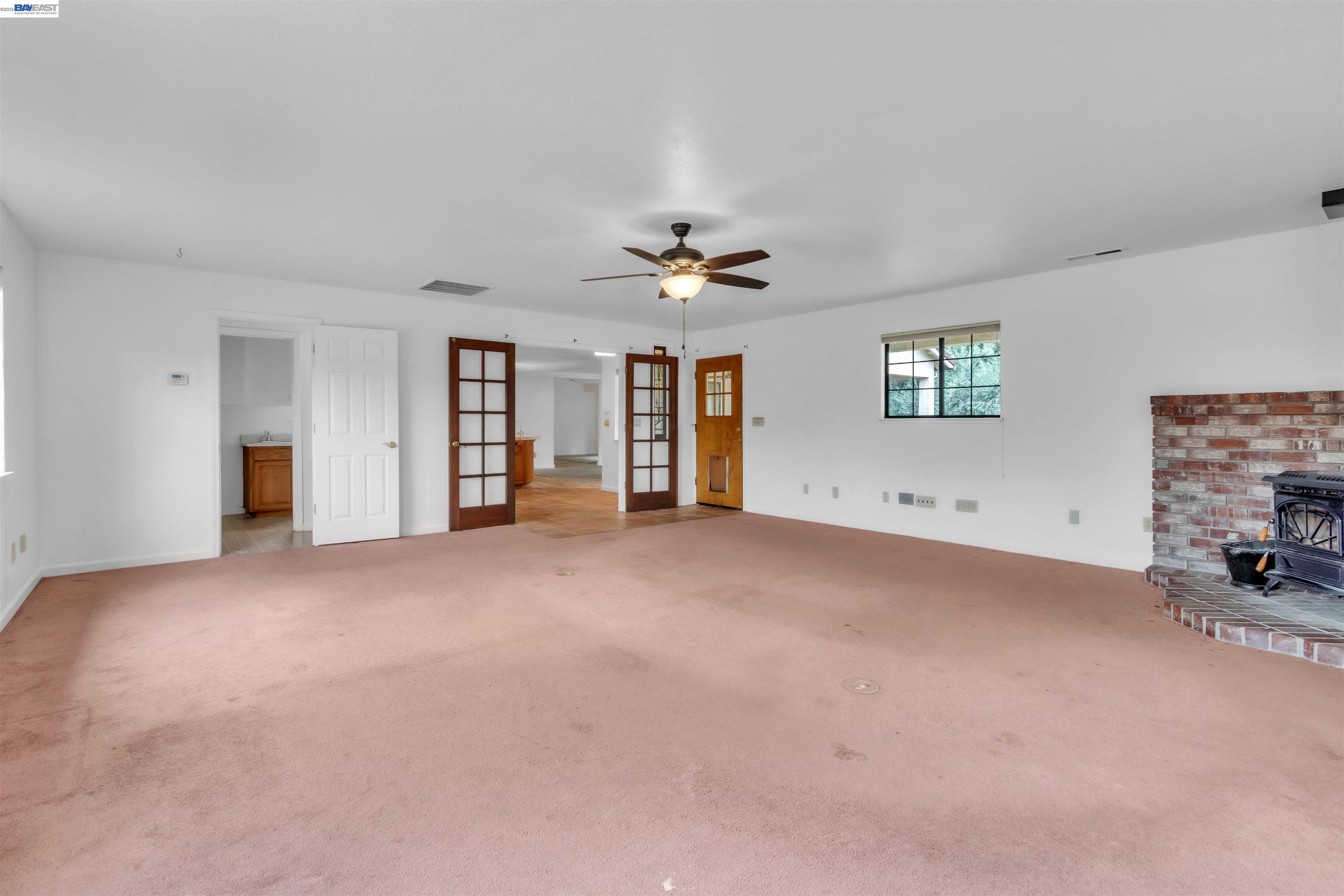 3665 Illinois Avenue Corning, CA 96021 - Photo 26 of 54 a view of a livingroom with a ceiling fan and window