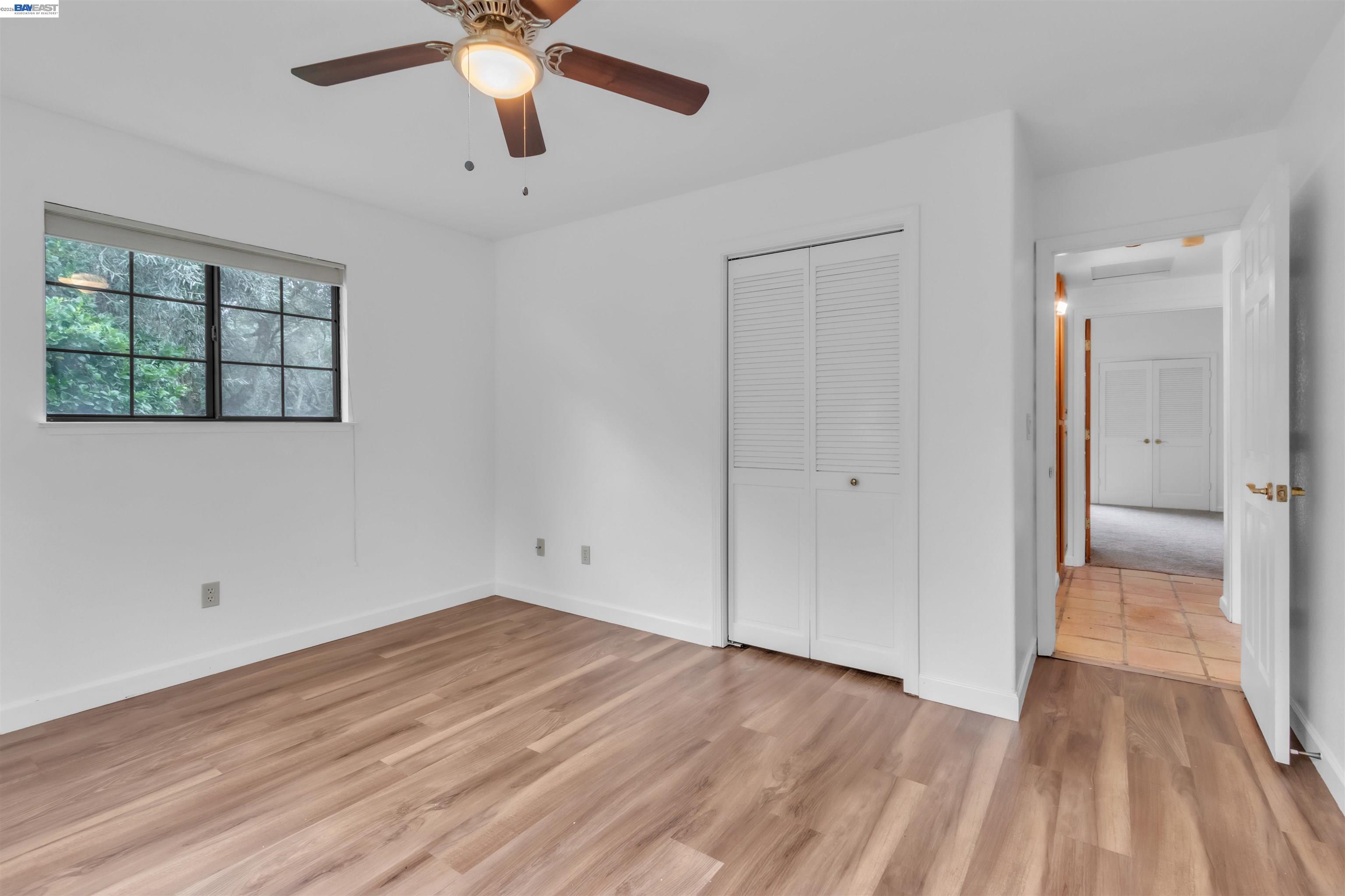 3665 Illinois Avenue Corning, CA 96021 - Photo 41 of 54 a view of empty room with wooden floor and fan