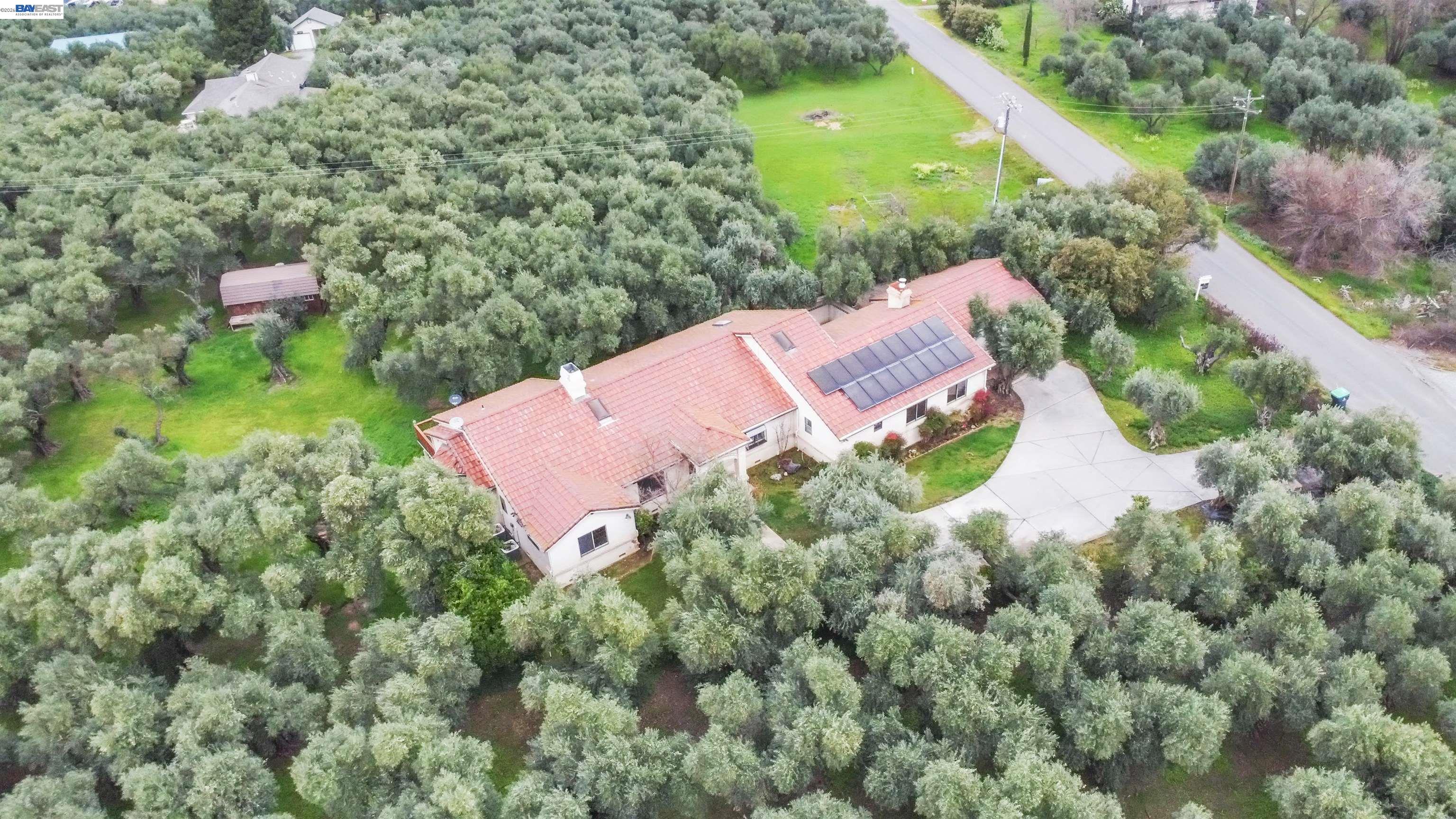 3665 Illinois Avenue Corning, CA 96021 - Photo 51 of 54 an aerial view of a house with a yard and outdoor seating