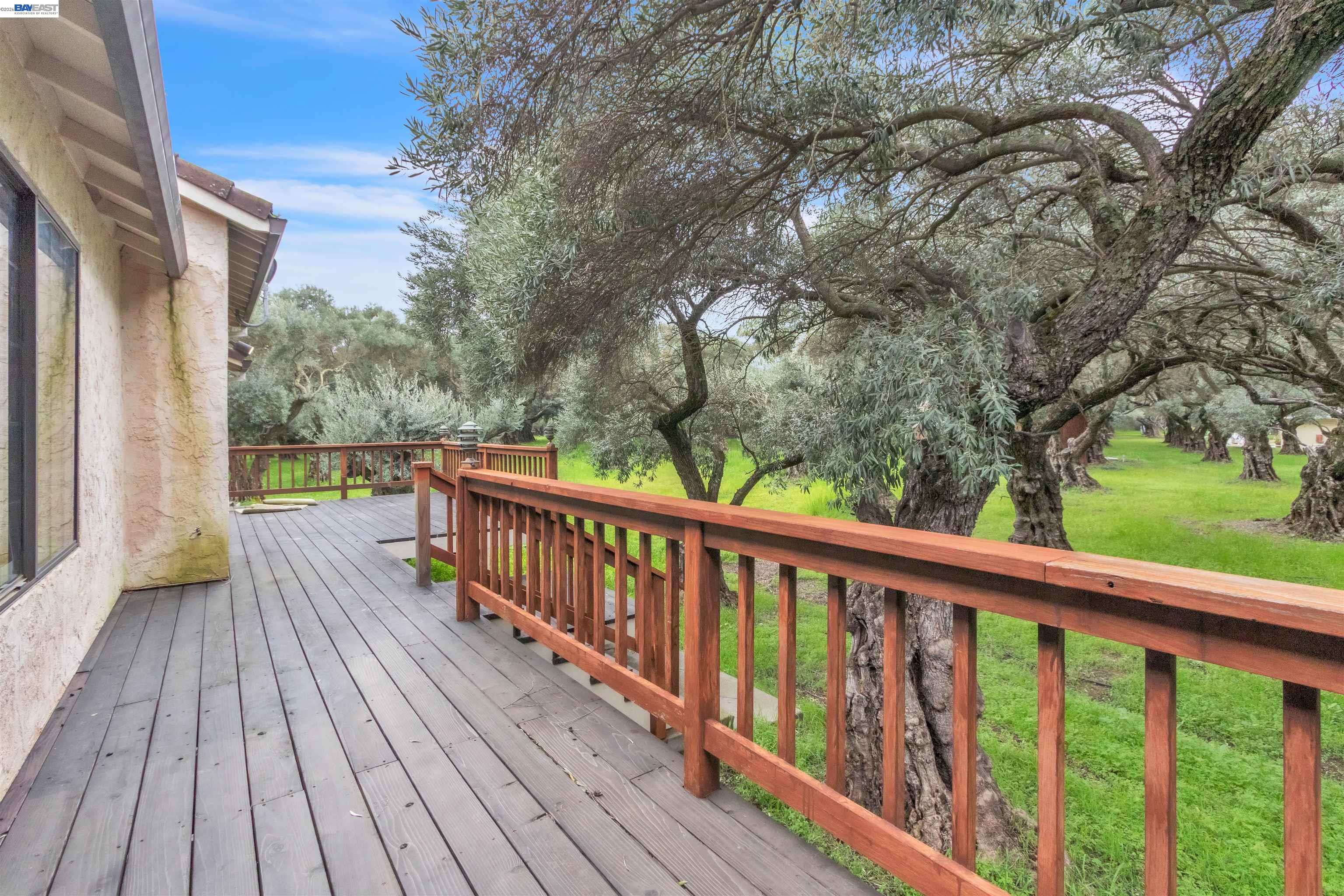 3665 Illinois Avenue Corning, CA 96021 - Photo 6 of 54 a view of balcony with wooden floor and fence