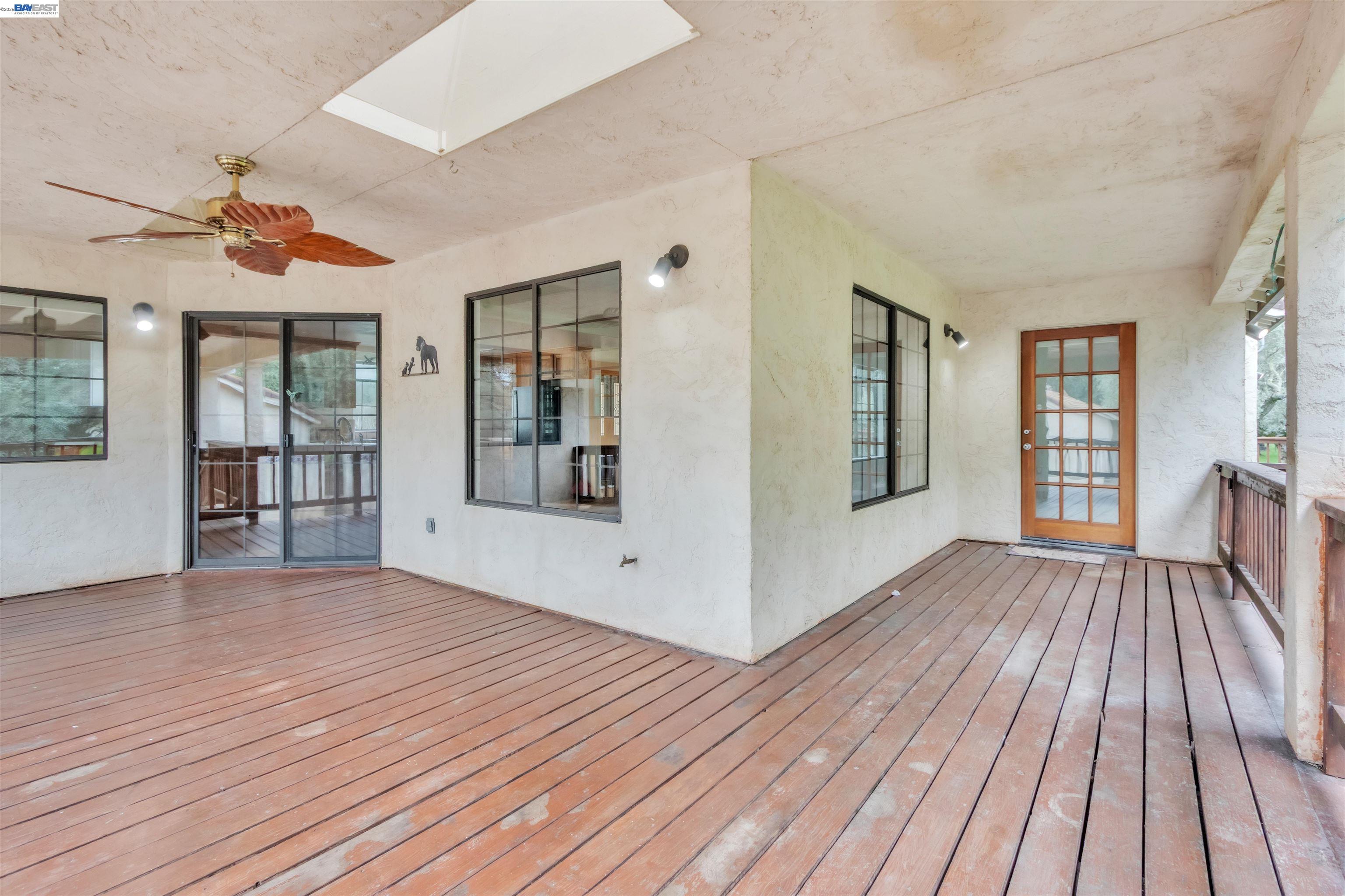 3665 Illinois Avenue Corning, CA 96021 - Photo 9 of 54 a view of an empty room with wooden floor and a window