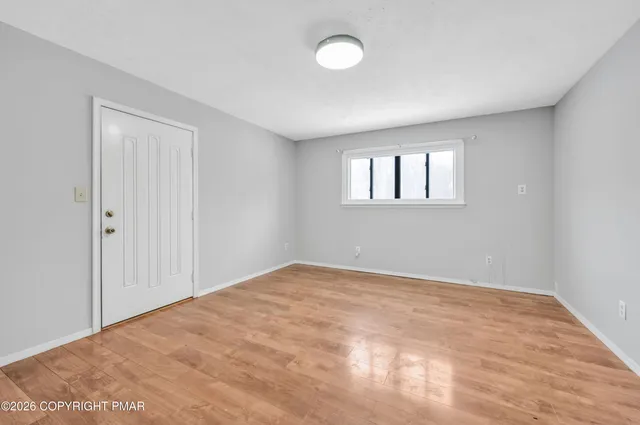 a view of empty room with windows