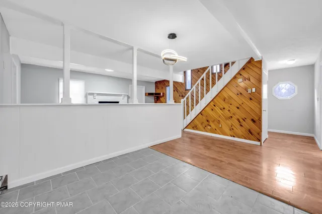a view of an entryway with wooden floor