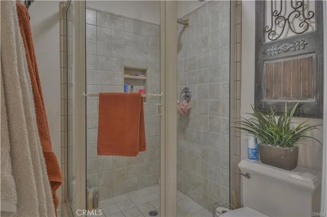 a front view of a house with yard and trees