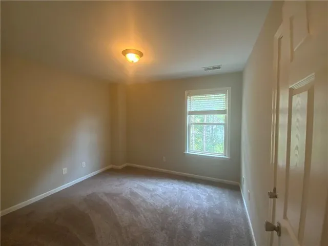 a bathroom with a shower and a sink