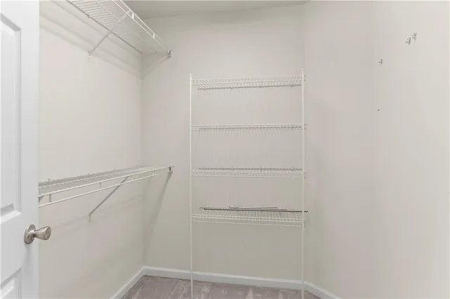 a backyard of a house with trampoline table and chairs