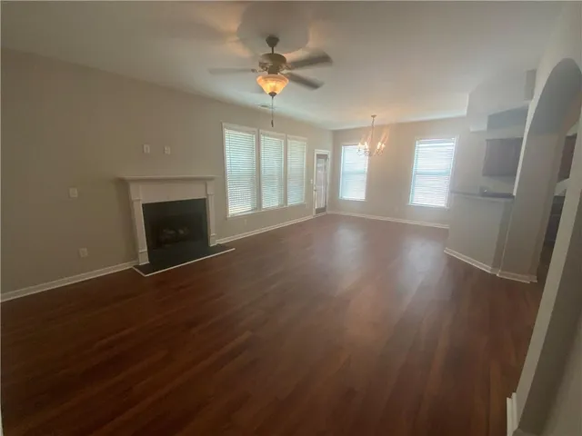 a spacious bathroom with a bathtub sink and mirror