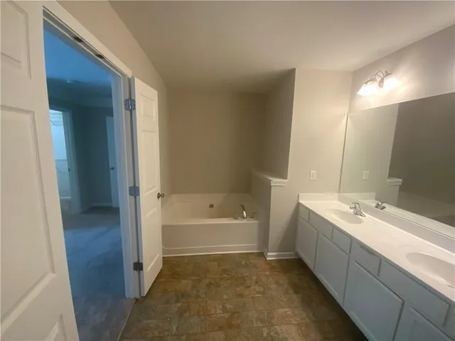 a view of a livingroom with a ceiling fan and window