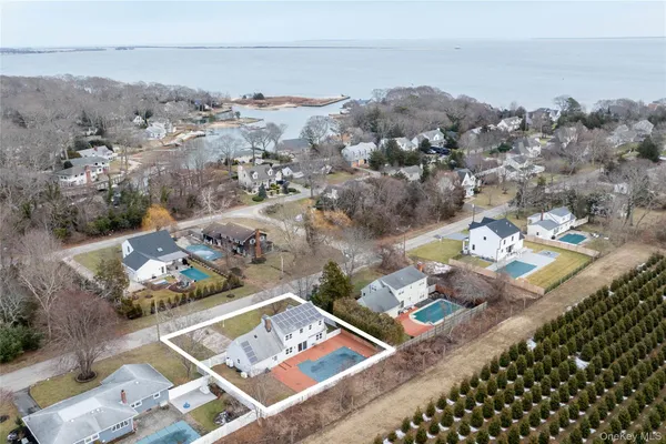 an aerial view of a house with a yard