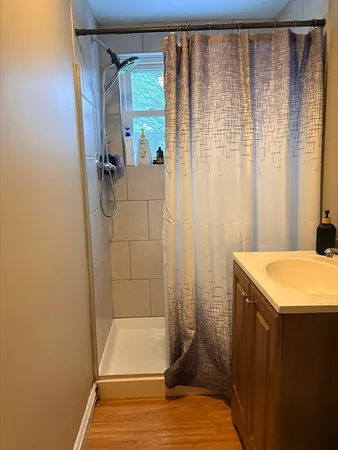 a bathroom with a tub and shower