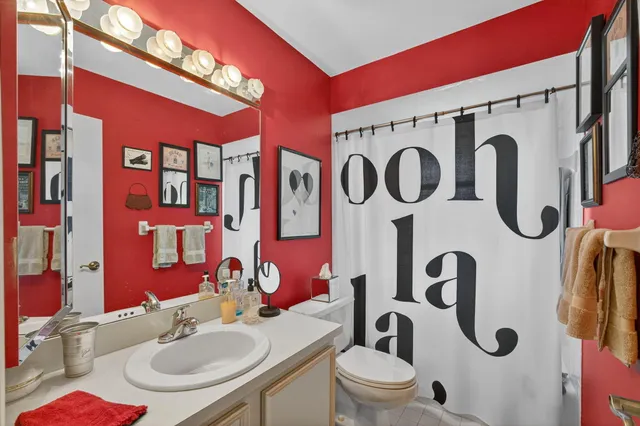 an aerial view of a house with a garden and mountain view in back