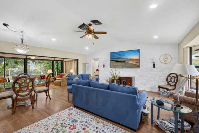 a living room with fireplace furniture and a flat screen tv