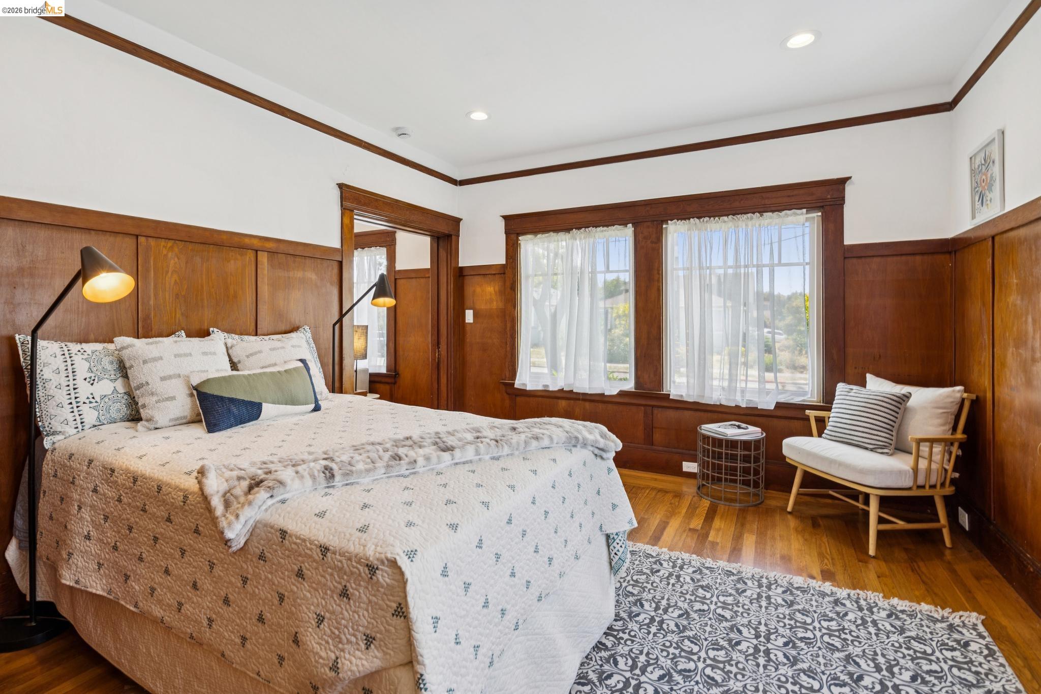 1701 Derby Street Berkeley, CA 94703 - Photo 29 of 39 Hardwood flooring throughout featuring wood panel wainscoting and trim
