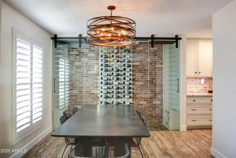 a kitchen with granite countertop a sink a window and stainless steel appliances