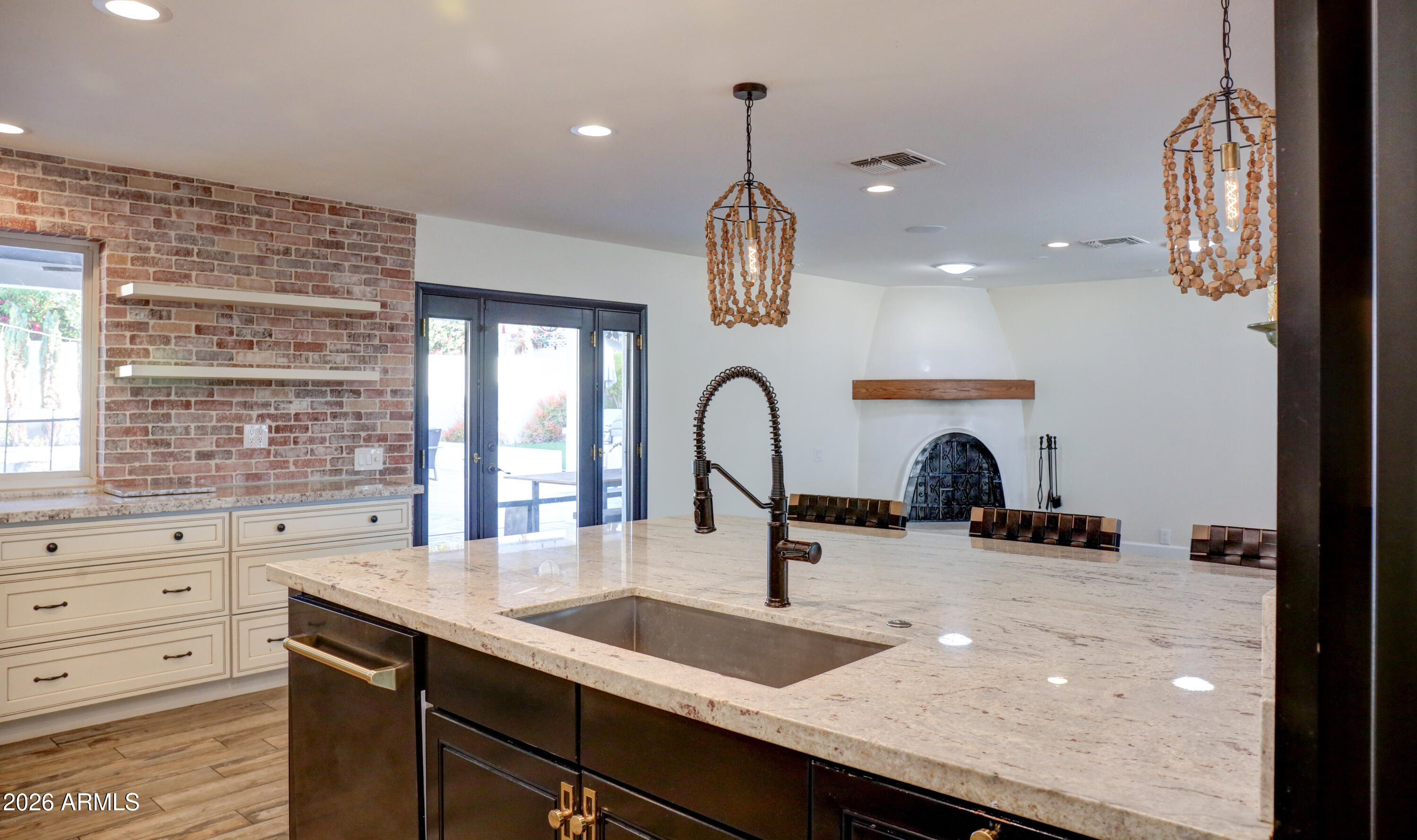 2016 East State Avenue Phoenix, AZ 85020 - Photo 17 of 42 a kitchen with granite countertop a sink a window and stainless steel appliances