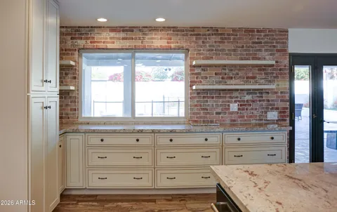 a bathroom with a sink double vanity and a mirror