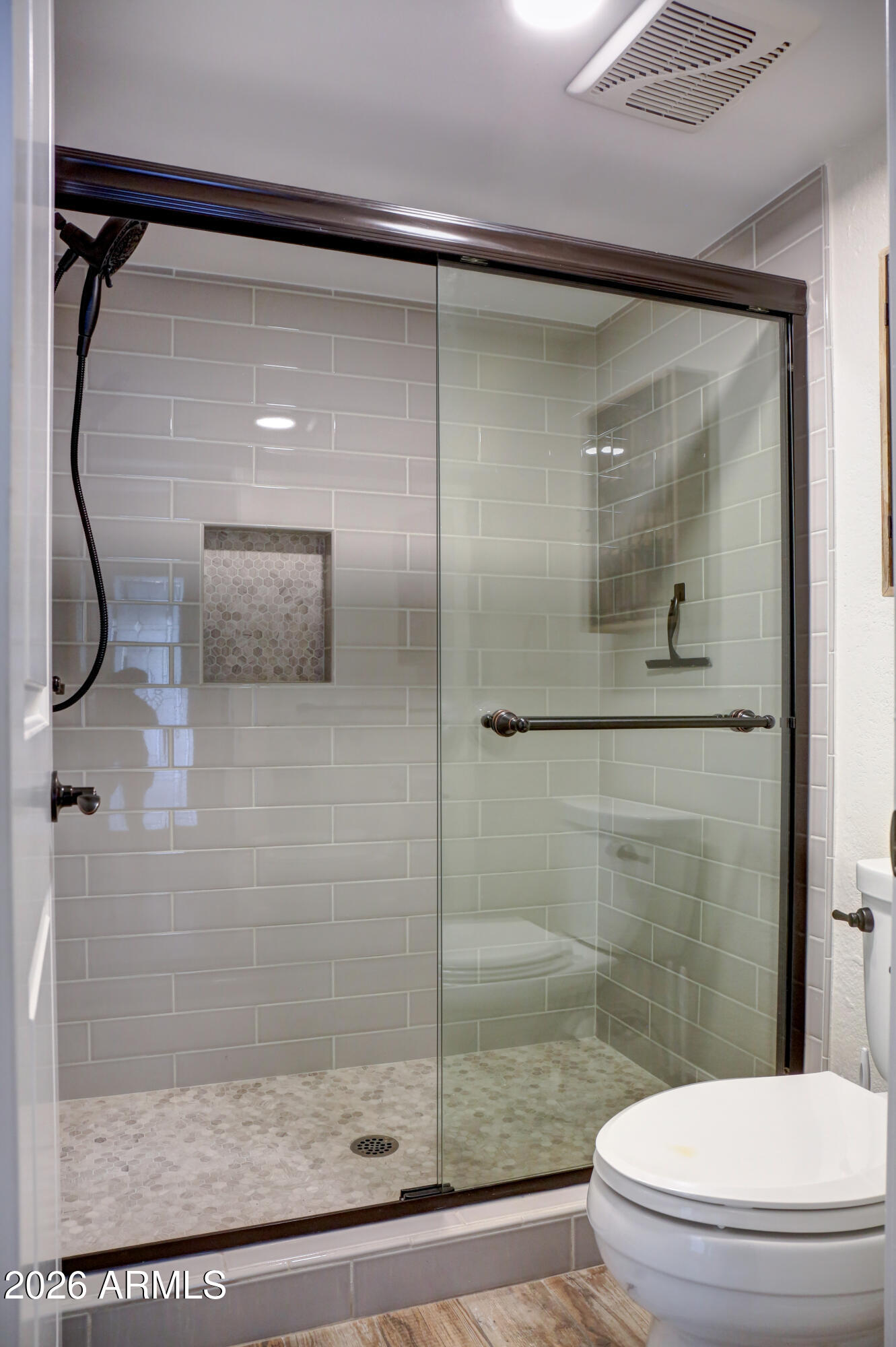 2016 East State Avenue Phoenix, AZ 85020 - Photo 21 of 42 a bathroom with a glass shower door