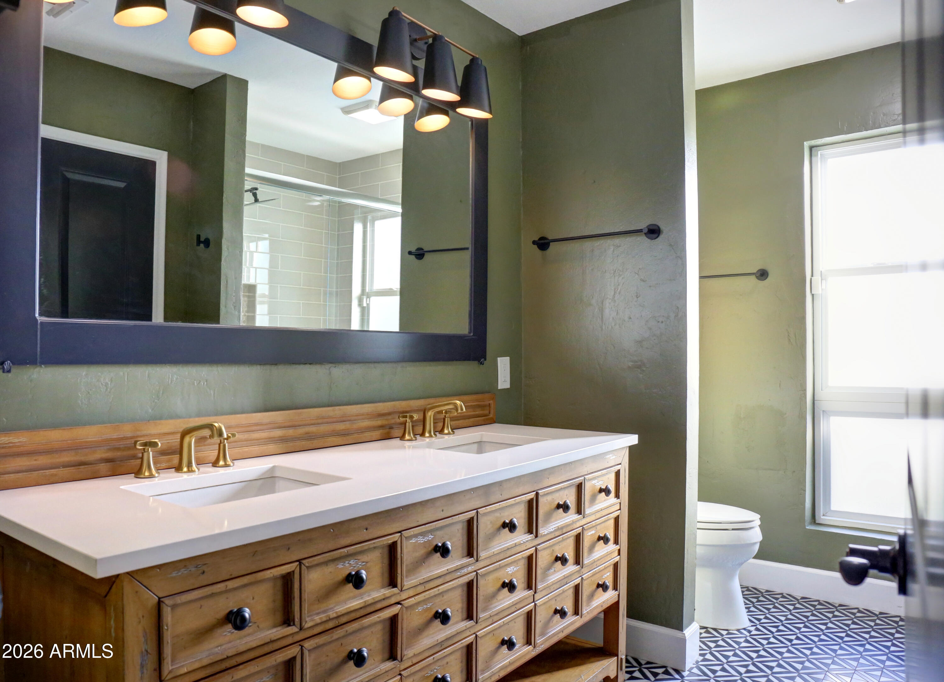 2016 East State Avenue Phoenix, AZ 85020 - Photo 34 of 42 a bathroom with a sink a toilet and a mirror