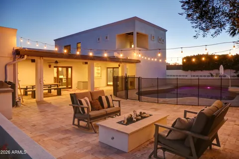 a living room with furniture window and wooden floor