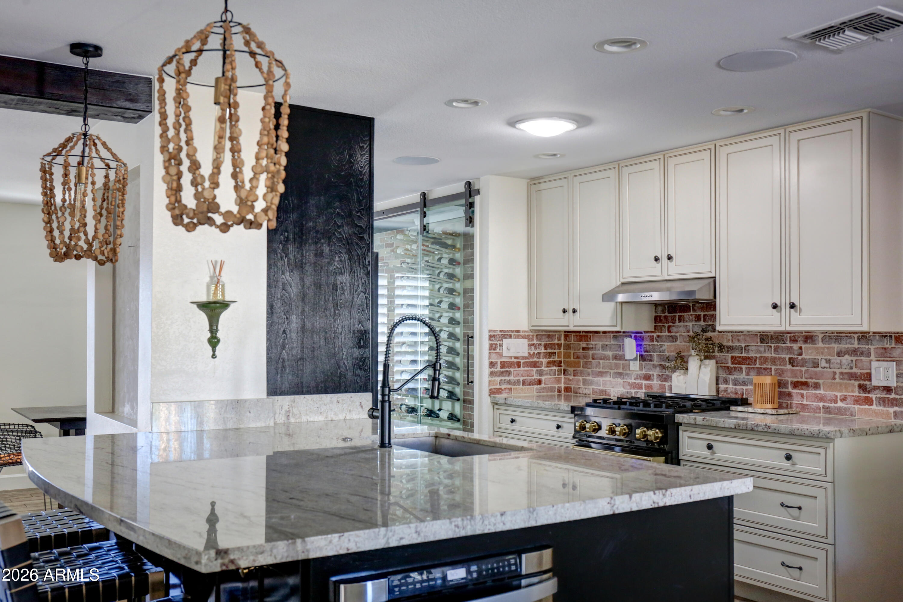 2016 East State Avenue Phoenix, AZ 85020 - Photo 5 of 42 a kitchen with stainless steel appliances granite countertop a sink a stove and a wooden cabinets