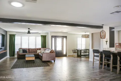 a kitchen with stainless steel appliances granite countertop a sink a stove and a refrigerator