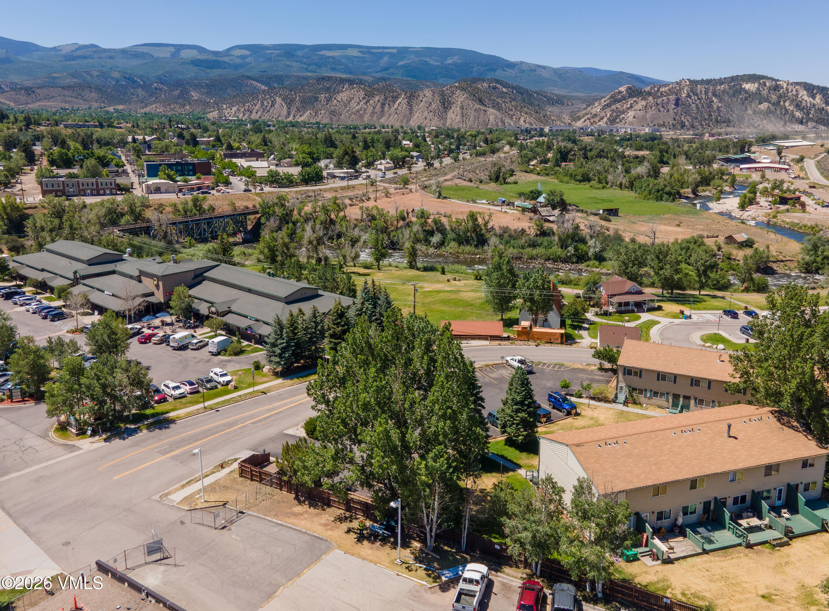 85 Chambers Avenue, Unit 10 Eagle, CO 81631 - Photo 38 of 41 an aerial view of a city with lots of residential buildings and mountain view in back