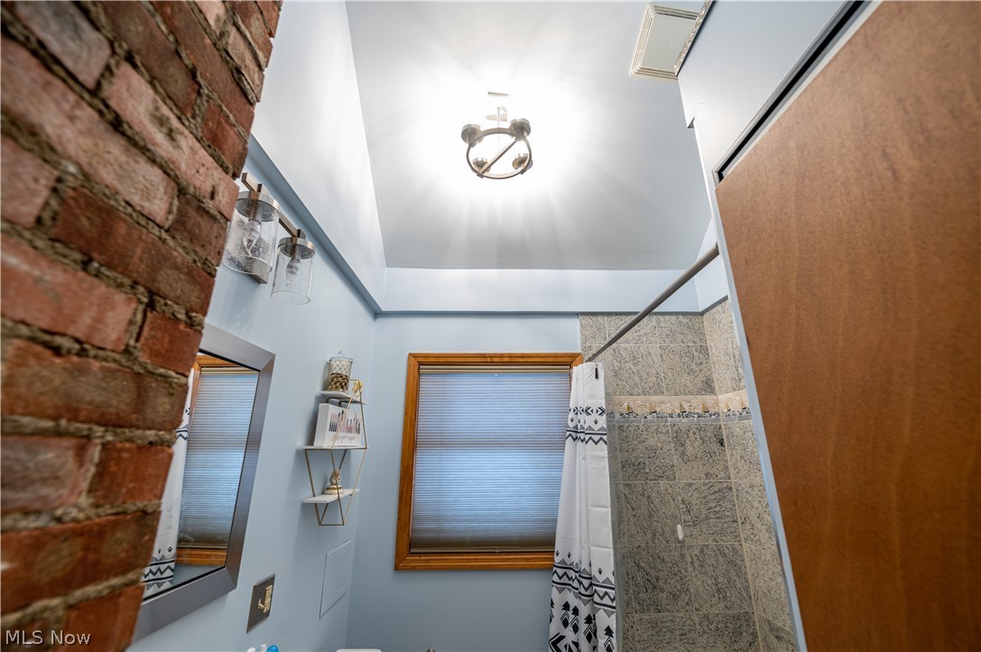 6520 Ridgewood Lakes Drive Parma, OH 44129 - Photo 15 of 34 don't forget the stylish vaulted ceiling and exposed brick